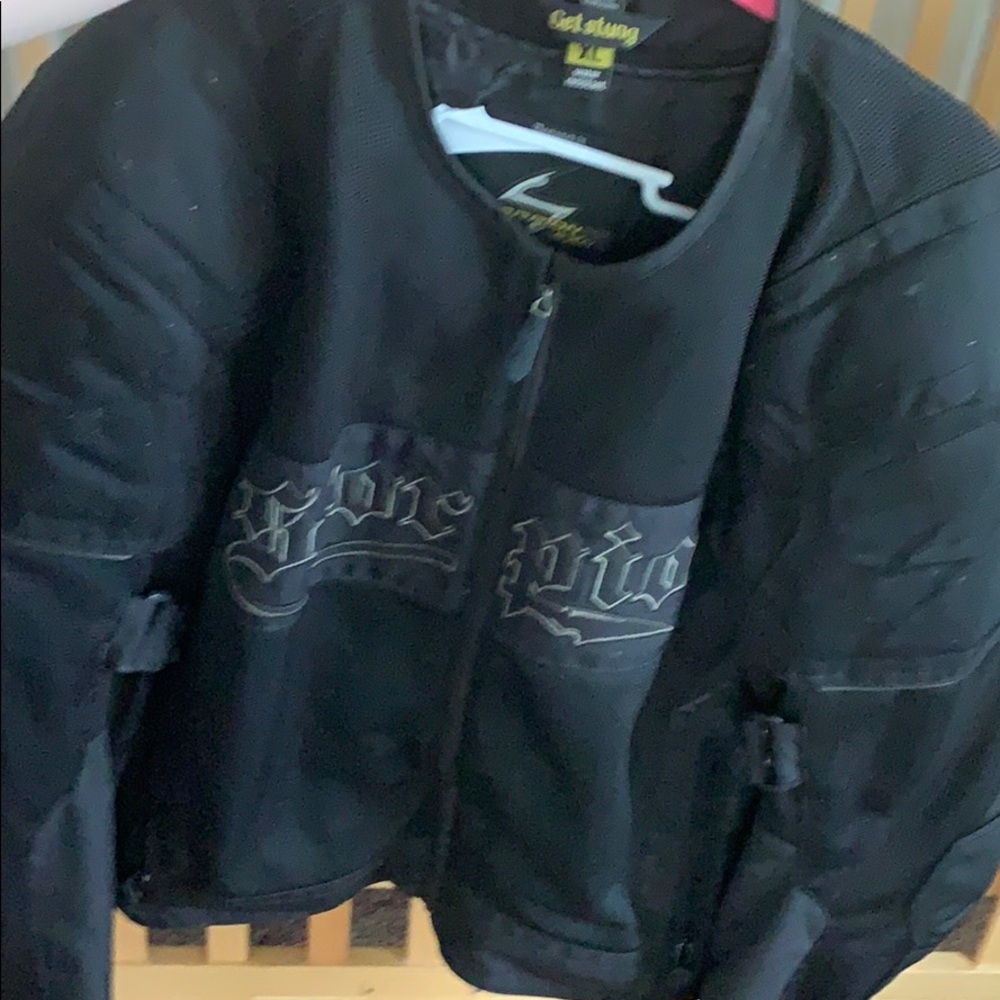 Black lined and padded motorcycle jacket